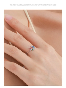 Macro shot of S925 silver chain ring featuring a U-shape charm with colorful zircons