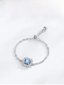 Detail of adjustable S925 silver chain ring with square blue zircon and pavé setting