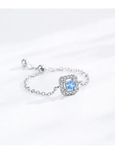 Macro detail of S925 silver adjustable chain ring with halo square blue zircon