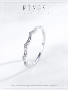 Detail view of S925 sterling silver wavy ring with micro-pave cubic zirconia stones