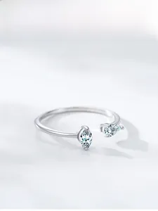 Macro shot of S925 sterling silver ring with two pear-cut zircon stones in a detailed view
