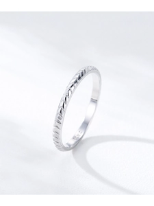Macro shot of S925 sterling silver ring featuring a textured chevron arrow pattern