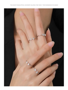 Detail of S925 sterling silver rings set featuring teardrop and square zircon settings