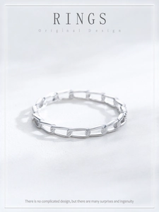 Detailed view of S925 sterling silver geometric hollow link ring on textured background
