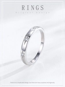 Detailed macro view of S925 sterling silver ring with engraved stars and zircon stone