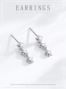 Macro shot of 925 sterling silver triple star drop earrings with S925 hallmark stamps
