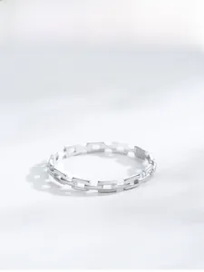 Macro detail of S925 sterling silver hollow chain ring with geometric link design