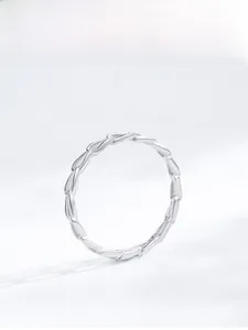 Macro shot of S925 sterling silver ring with delicate woven texture and geometric design
