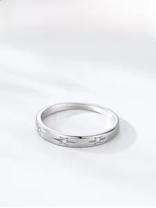 Macro detail of 925 sterling silver star ring featuring sparkling cubic zirconia stones