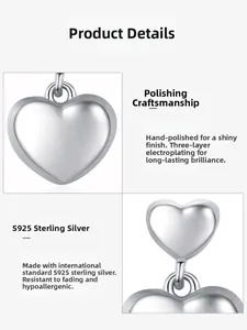 Detail of polished S925 sterling silver heart earrings with triple-layer electroplating