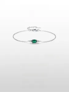 Detailed close-up of S925 sterling silver clasp and emerald green oval gemstone charm