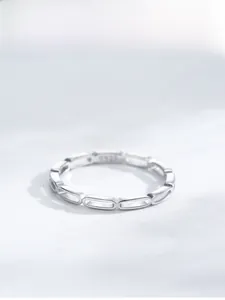 Close-up of S925 sterling silver ring with hollow chain link pattern and logo engraving