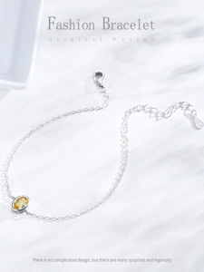 Detail of S925 sterling silver chain with oval amber zircon and hallmark tag