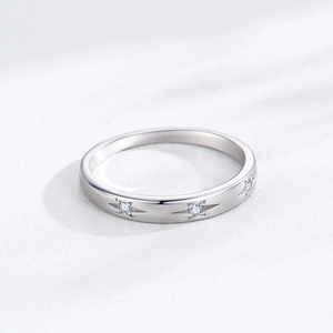 Elegant 925 sterling silver star ring with sparkling cubic zirconia on white surface