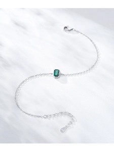 Detail view of S925 sterling silver bracelet with emerald-cut green zircon and lobster clasp
