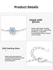 Macro detail of S925 sterling silver bracelet with blue zircon floral pendant