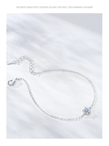 Detailed close-up of S925 sterling silver bracelet with blue zircon flower pendant