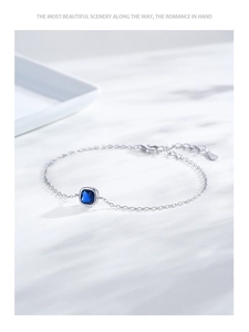 Detailed close-up of S925 silver bracelet with square blue gemstone and lobster clasp