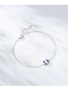 Detailed macro of S925 sterling silver horseshoe bracelet with colorful gemstones