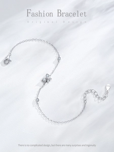 Macro shot of S925 sterling silver butterfly bracelet with shimmering zircon stones