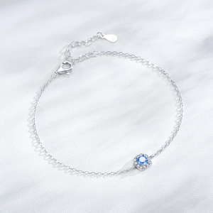 Minimalist S925 silver bracelet featuring a square blue zircon and pavé halo setting