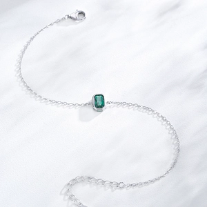 Elegant S925 sterling silver bracelet with emerald-cut green zircon and adjustable chain