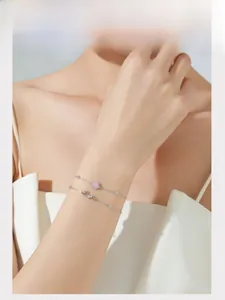 Detail of S925 sterling silver double-layer bracelet with pink zircon and LOVE charm