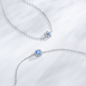Elegant S925 sterling silver bracelet with blue floral and hexagonal gemstone charms