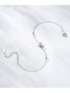 Macro shot of S925 sterling silver butterfly bracelet with shimmering zircon stones