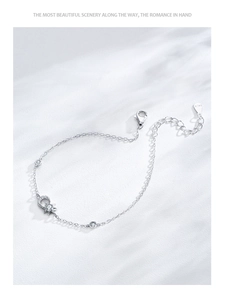 Detailed view of S925 sterling silver star and moon bracelet with shimmering zircon stones