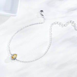 Elegant S925 sterling silver chain bracelet featuring a yellow oval zircon and adjustable clasp