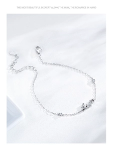 Detailed macro view of S925 silver bracelet featuring a Love charm and zircon stones