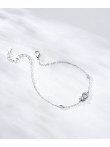 Close-up of S925 sterling silver sun and moon bracelet with zircon accents and lobster clasp