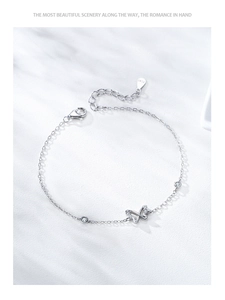 Macro detail of S925 sterling silver bow bracelet with cubic zirconia and lobster clasp