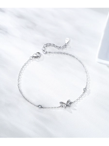 Macro shot of S925 sterling silver butterfly bracelet with shiny zircon inlay details