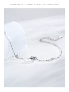 Close-up of S925 sterling silver heart bracelet with sparkling zircon and adjustable chain
