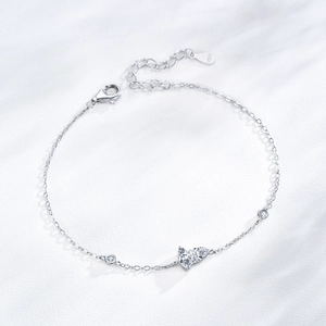 S925 sterling silver butterfly bracelet with sparkling zircon stones on white texture
