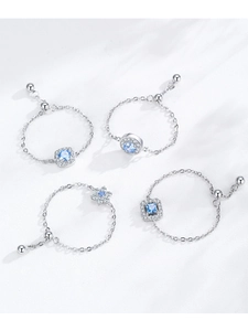Detail of adjustable S925 silver chain rings with blue zircon stones and slide buckle
