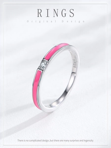 Macro shot of S925 sterling silver ring featuring pink enamel and a central zircon stone