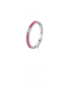 Macro detail of S925 sterling silver ring featuring pink enamel and a sparkling zircon