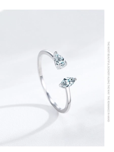Macro shot of S925 silver open ring featuring two pear-cut sparkling zircon stones