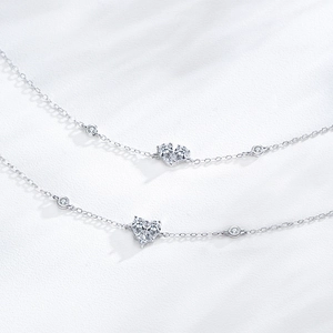 Elegant S925 sterling silver heart bracelet with sparkling stones on textured white background