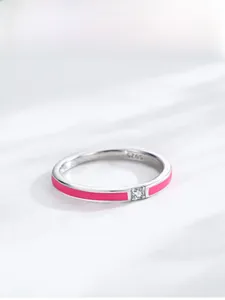 Detailed view of S925 sterling silver ring with pink enamel and central zircon stone