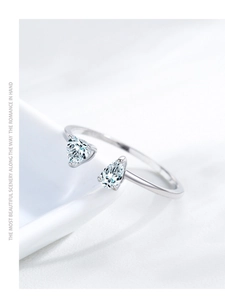 Close-up of S925 sterling silver open ring with dual pear-shaped sparkling zircons