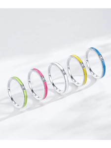 Detail showing five S925 sterling silver rings with colorful enamel finishes and tiny zircons