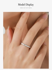 Close-up of S925 sterling silver ring with white enamel and square gemstone on a model