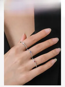 Close-up of three S925 sterling silver rings with colorful micro-inlaid cubic zirconia