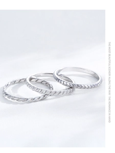 Detailed close-up of S925 sterling silver rings showing texture and hallmarked stamps