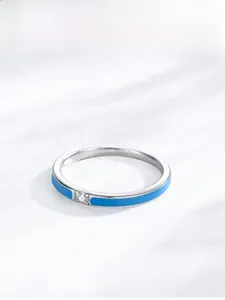 Detail of S925 silver ring featuring sky blue enamel and a centered sparkling zircon