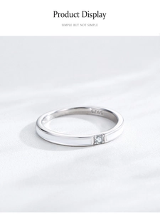 Macro view of S925 sterling silver ring with white enamel and sparkling zircon detail
